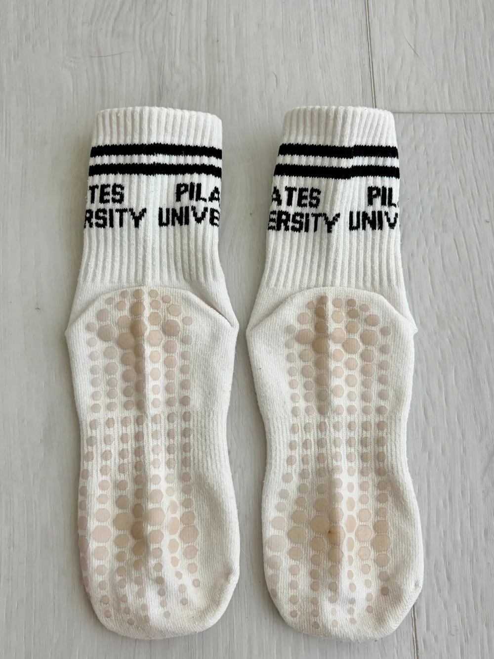 4 pairs of very gently used Pilates grip socks - crew length - women’s S/M.